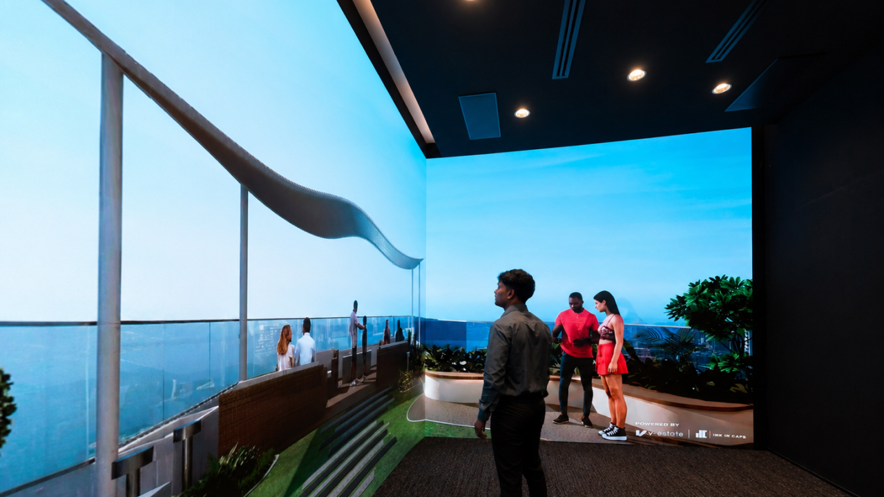 immersive experience center with curved digital screen showing a sea-facing real estate walkthrough